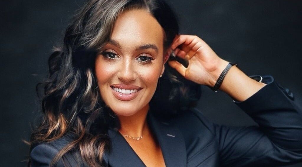 Smiling individual in stylish attire at SA Artistry, Arklow, County Wicklow, IE showcasing beauty and confidence.