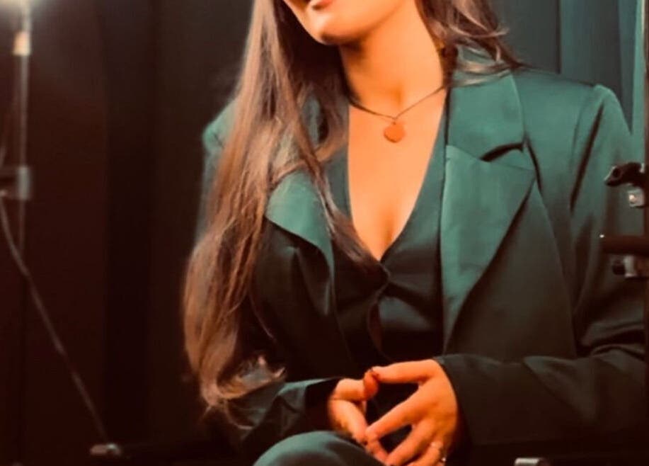 Portrait of a woman in a dark green suit at SA Artistry, Arklow, County Wicklow, IE.