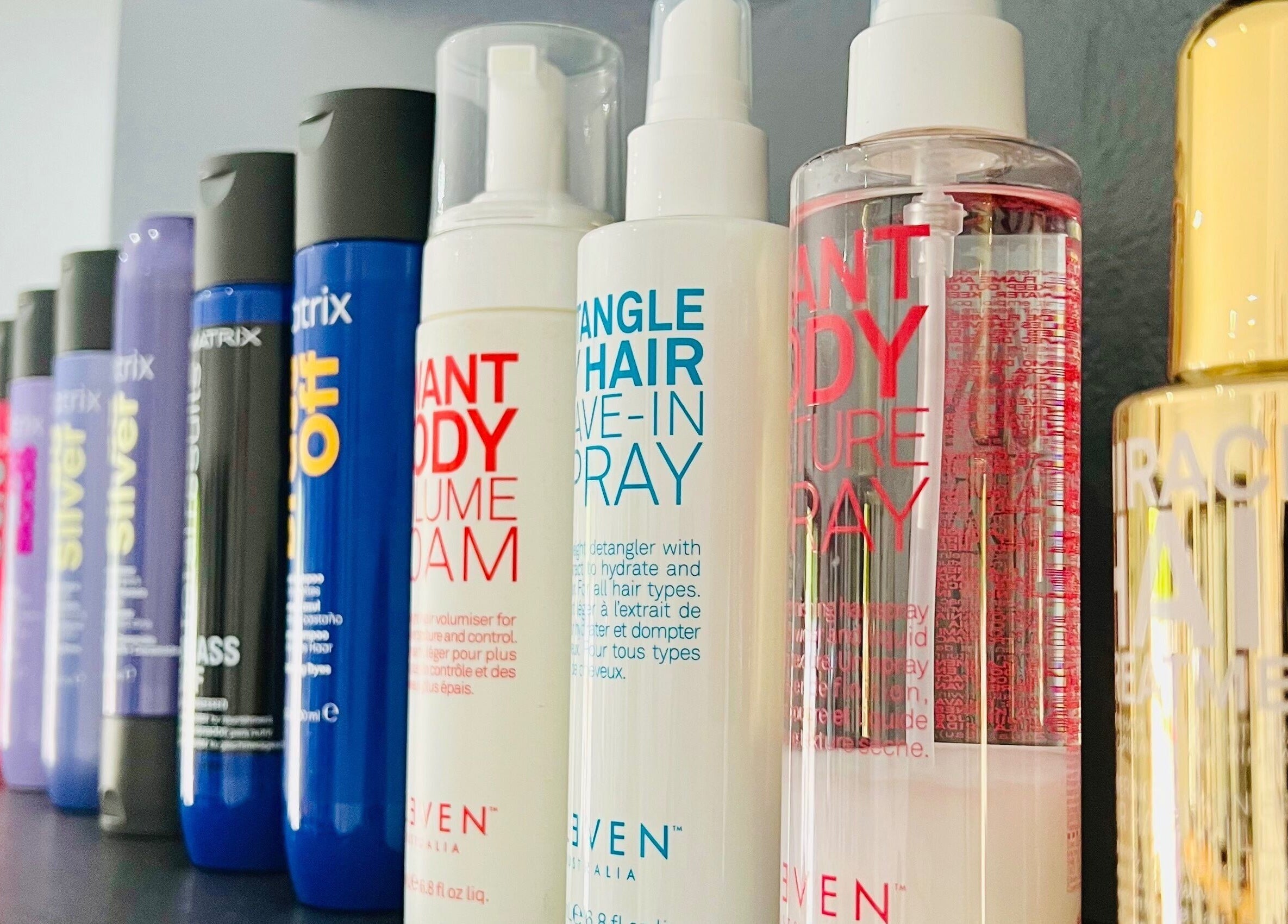 Hair products at Hair Vogue Salon in Hillcrest, Kwazulu-natal, ZA. Diverse selection on display shelf.