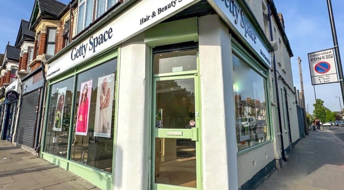 Front view of Getty Space salon in London, England, GB with stylish window displays.