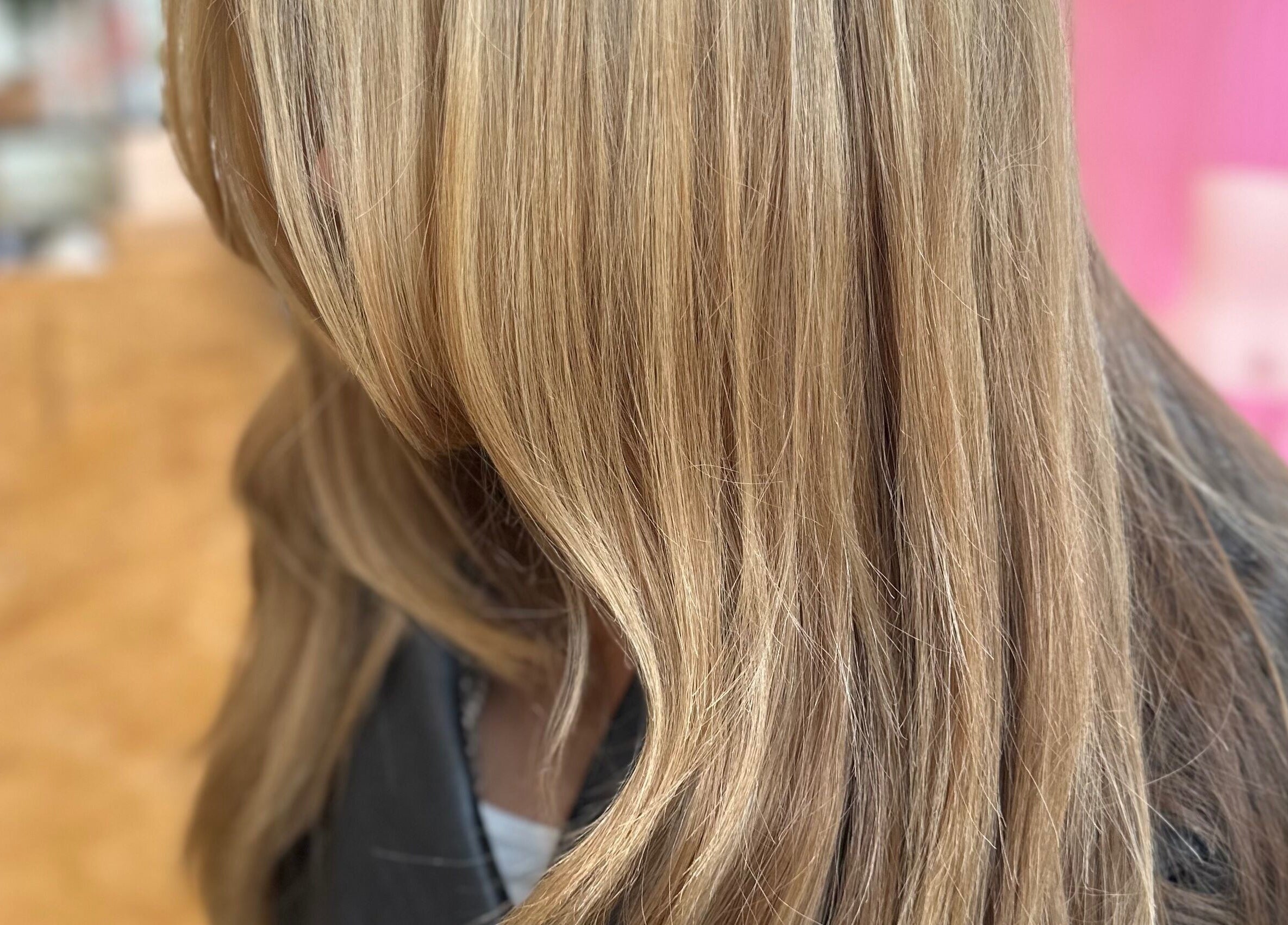 Close-up of silky blonde hair styled at Getty Space in London, England, GB, featuring soft waves.
