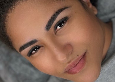 Close-up of a woman's face showcasing flawless skin at L’essence Beauty By Ranielly, Waterford, County Waterford, IE.