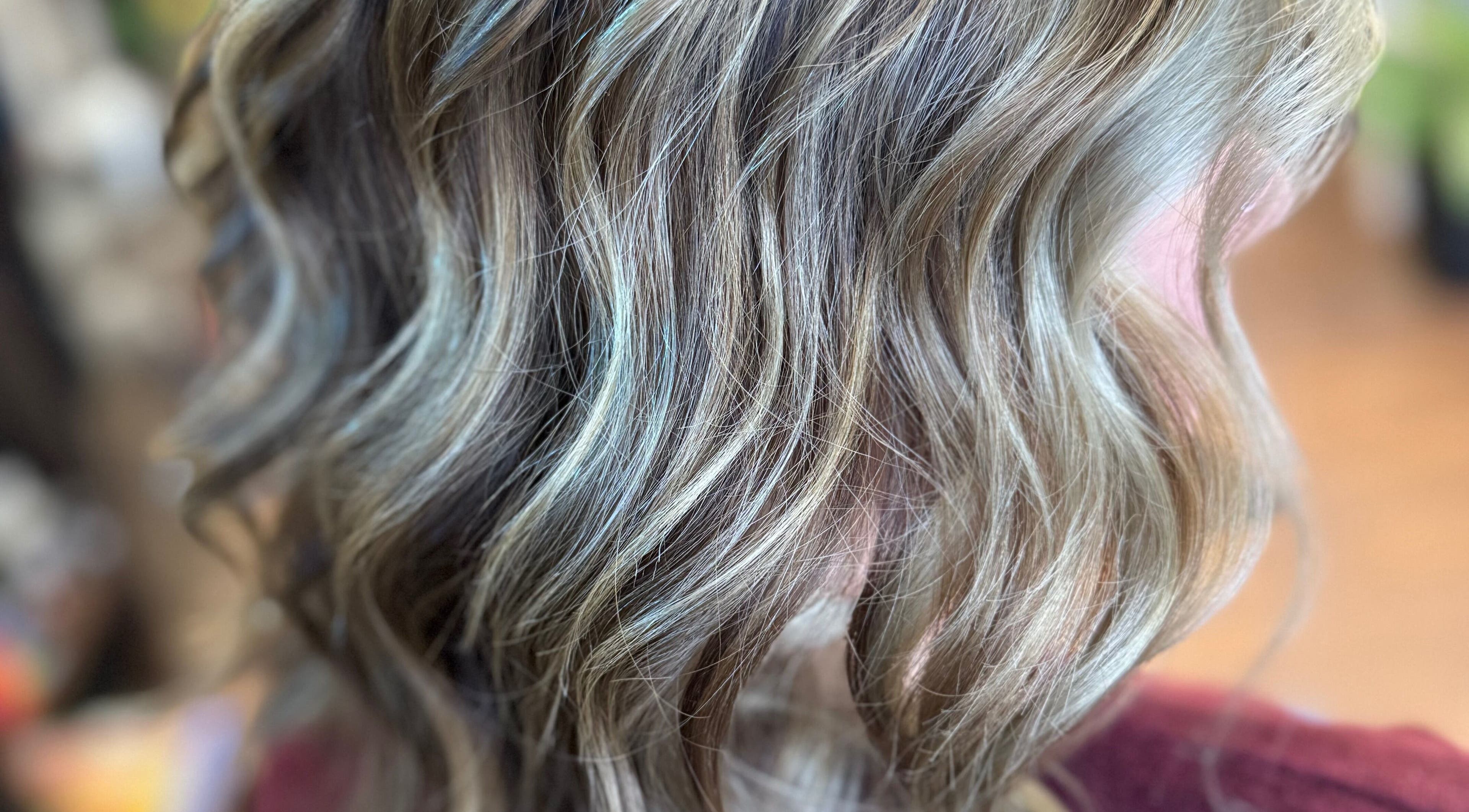 Close-up of wavy blonde hair styled at WONDERFULLY MADE YOU LLC in Statesville, North Carolina, US.