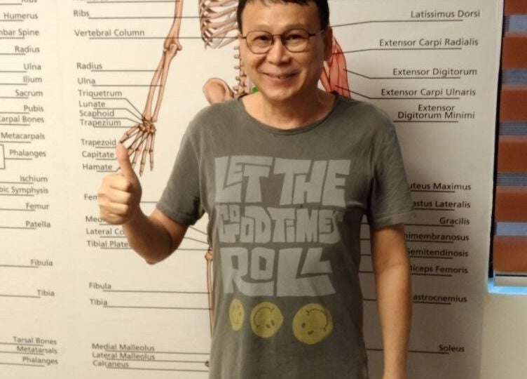 Happy customer at Advanced Muscle Therapy in Petaling Jaya, Selangor, MY with anatomical diagrams.