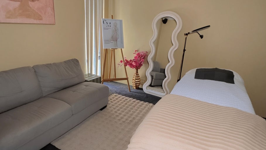 Chic spa room at Contour Me, Aubin Grove, Western Australia, AU showcasing elegant decor and a tranquil bed setup.