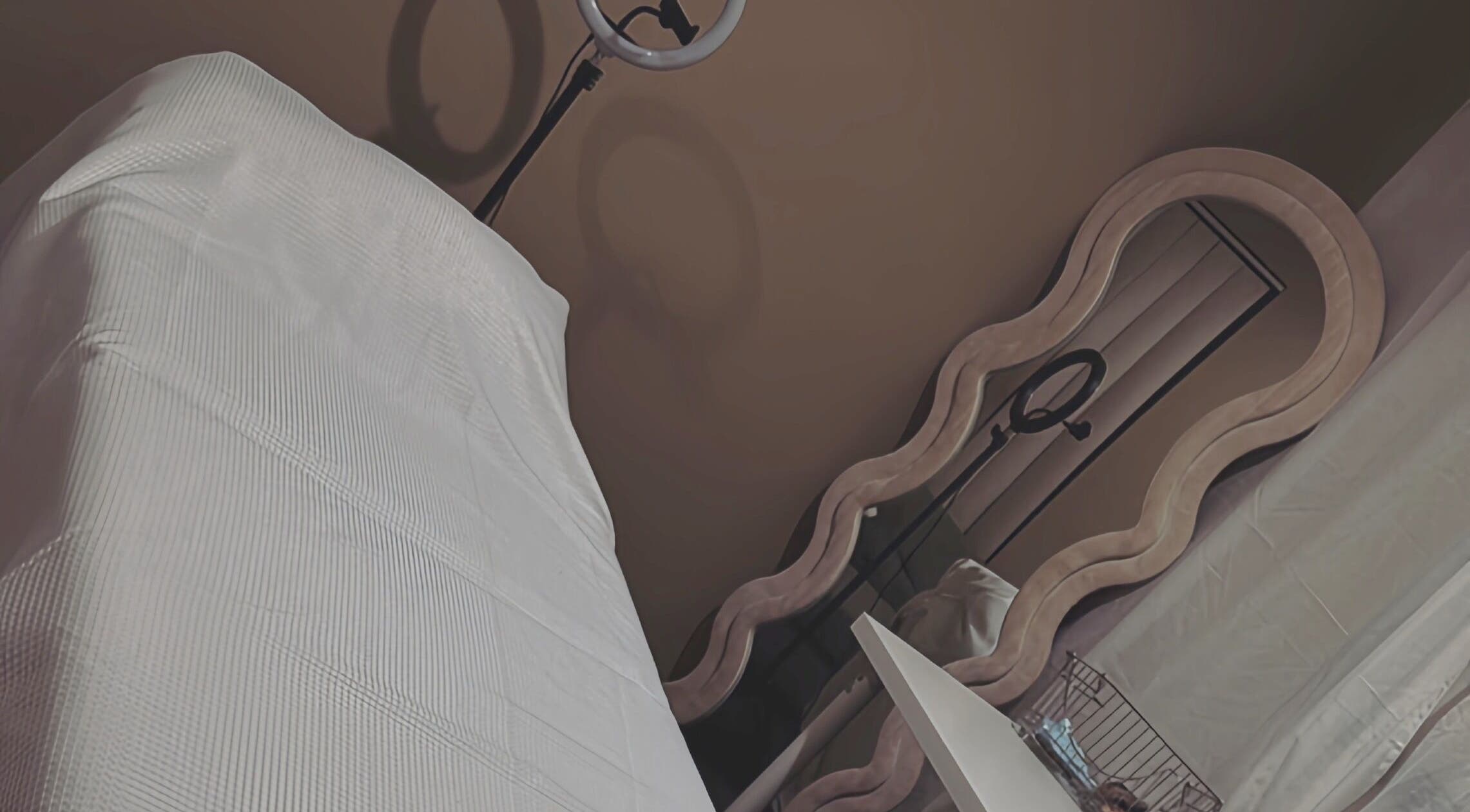 Relaxing treatment room at Contour Me, Aubin Grove, Western Australia, AU with a cozy massage table and mirror.