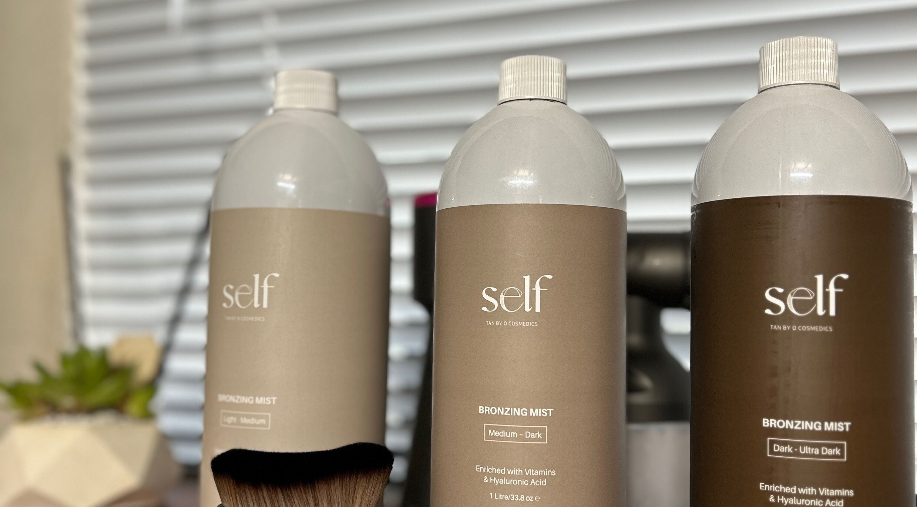 Self-tanning mist bottles at Oh Tan, Mundijong, Western Australia, AU, offering a flawless bronzed look.