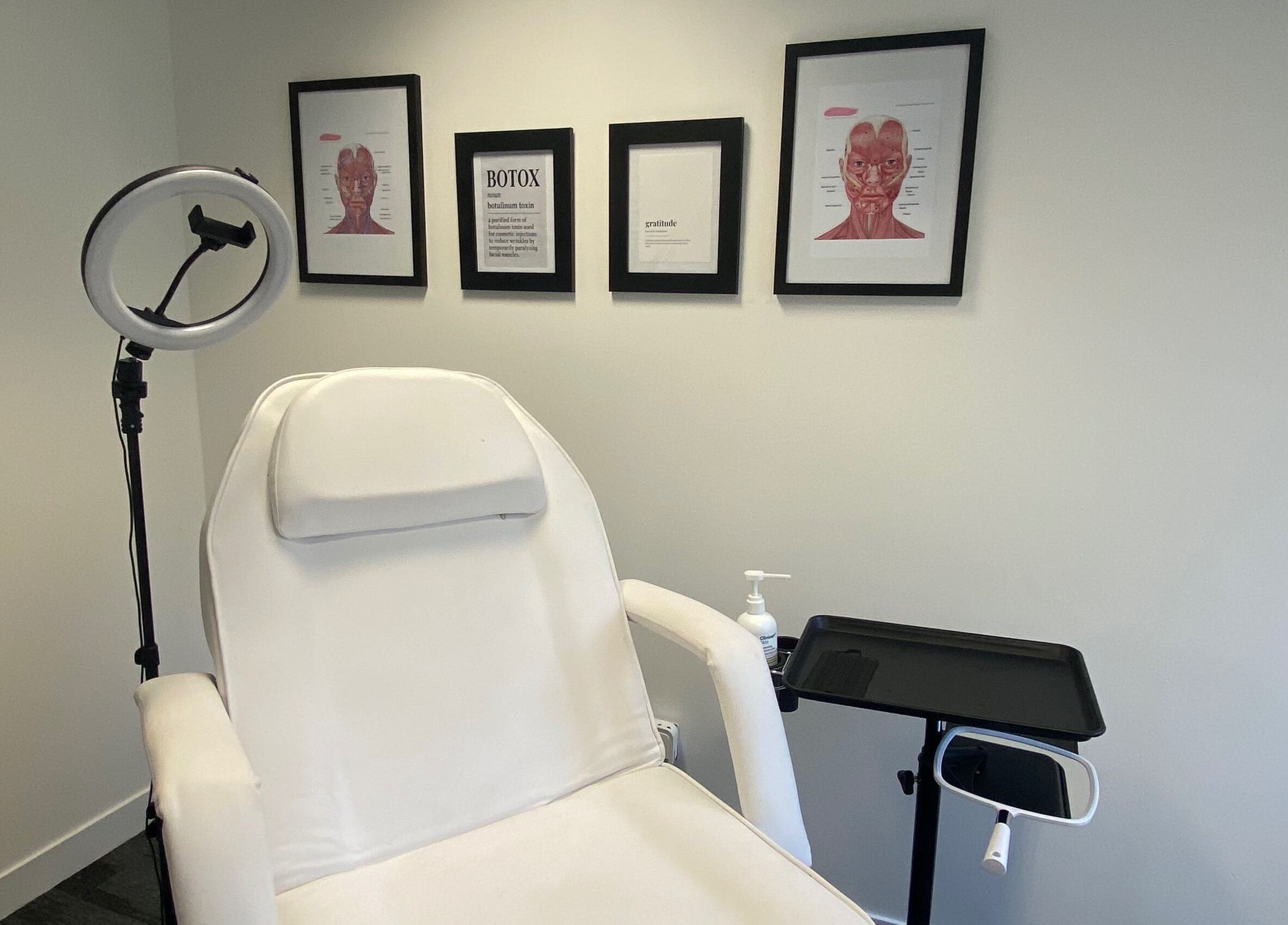 Modern treatment room at Ebbsfleet Aesthetics, Northfleet, England, GB featuring a comfortable white reclining chair.