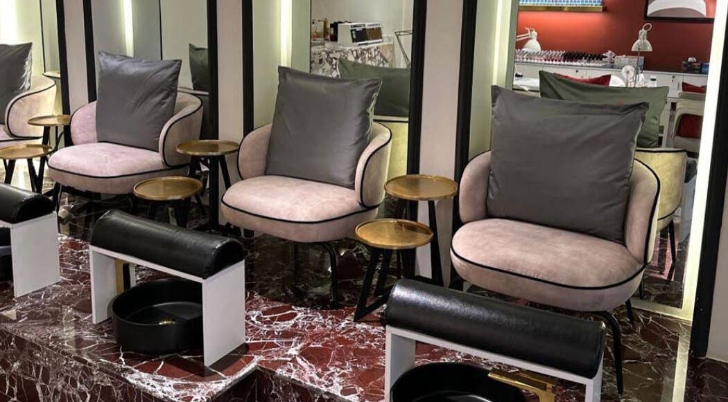 Elegant nail salon seating at Clue Salon, Riyadh, Riyadh Province, SA, featuring plush chairs and marble floors.