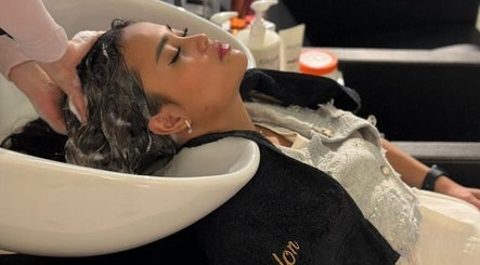 Relaxing hair wash at Clue Salon, Riyadh, Riyadh Province, SA, featuring gentle scalp massage.
