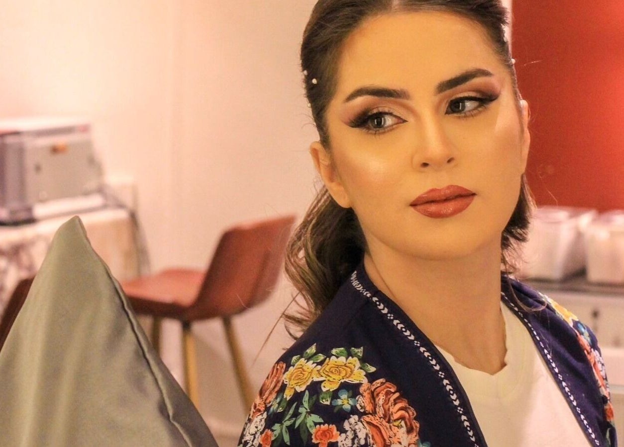 A woman with elegant makeup and hairstyle at Clue Salon, Riyadh, Riyadh Province, SA.