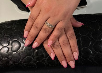 Perfect pink-tipped nails at Clue Salon, Riyadh, Riyadh Province, SA, showcasing elegant nail art.