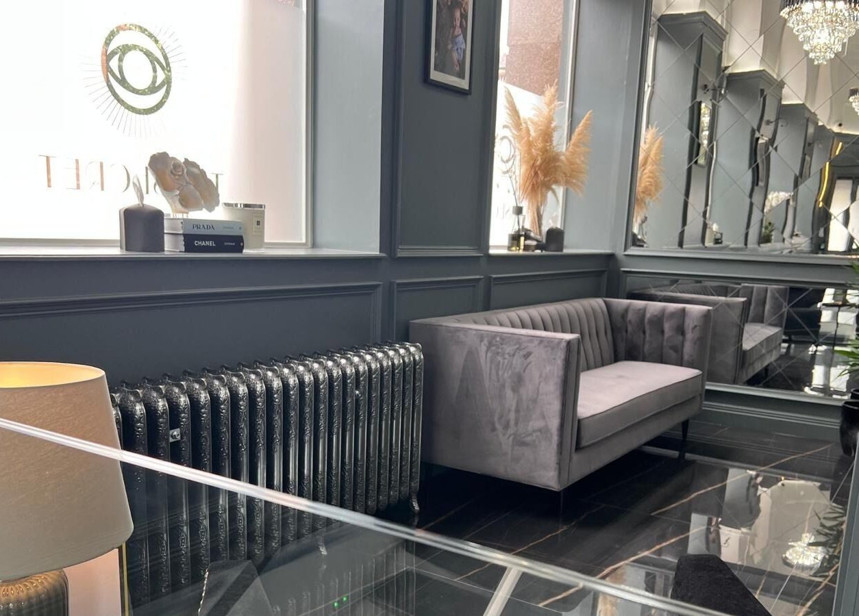 Elegant waiting area at NEU® Cosmetic Clinic Glasgow, featuring plush seating and designer decor in Glasgow, Scotland, GB.