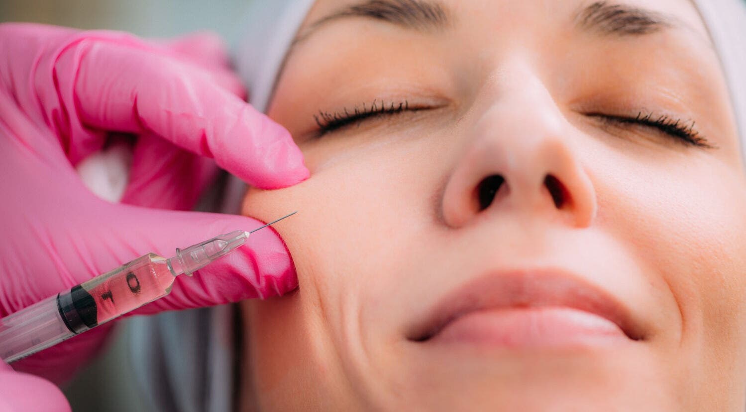 Facial injection at De-Vaux Aesthetics, Tattingstone, England, GB enhancing facial beauty.