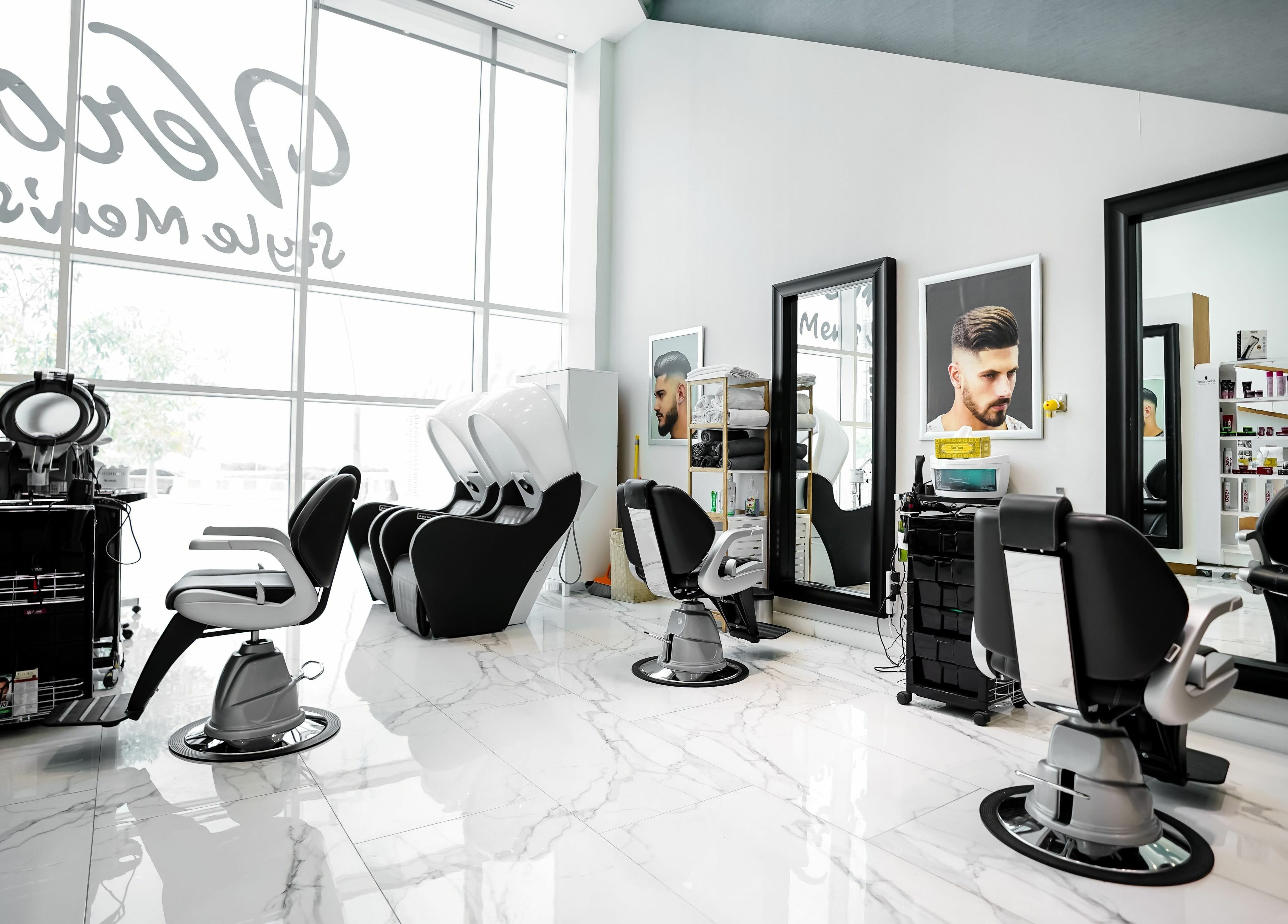 Stylish interior of Verona Style Mens Salon in Abu Dhabi, AE featuring modern barber chairs and sleek design.