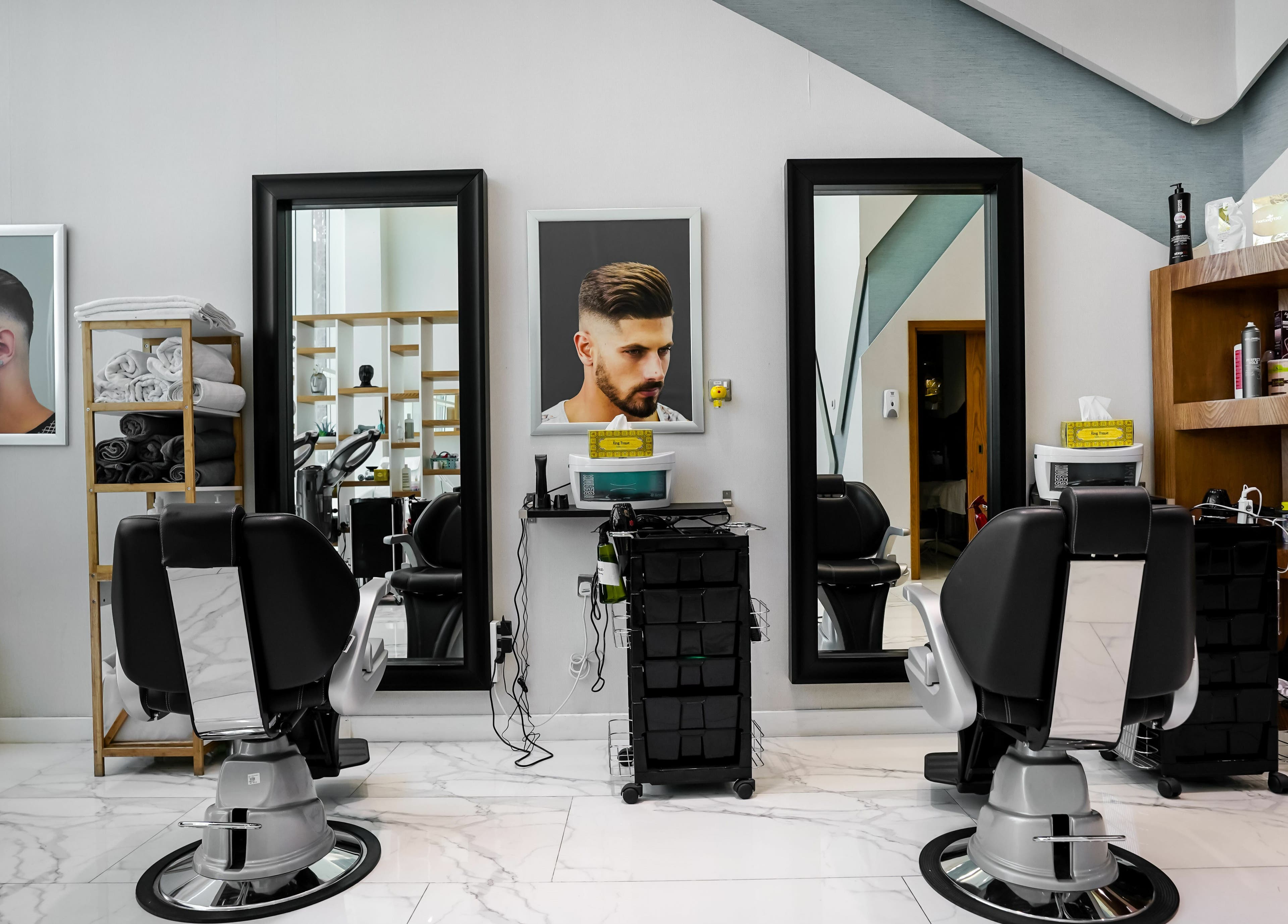 Modern barber chairs and styling products at Verona Style Mens Salon, Abu Dhabi, AE.