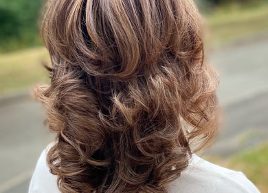 Elegant curly hairstyle at Iliana’s Hair Salon in Chineham, England, GB, showcasing professional styling.