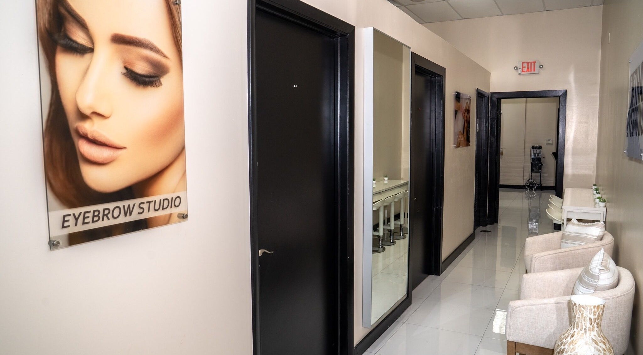 Chic interior hallway of RÊVE AESTHETICS by eyebrow studio in Doral, Florida, US with stylish decor.