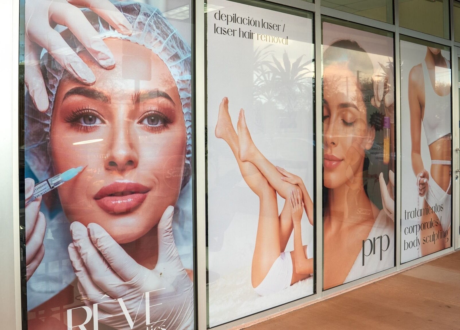 Bright storefront of RÊVE AESTHETICS by eyebrow studio in Doral, Florida, US featuring beauty service ads.