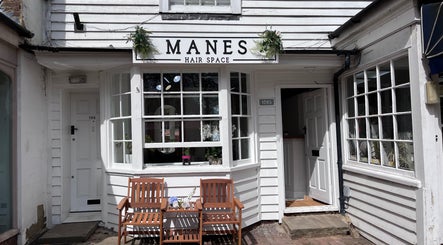 Front view of Manes Hair Space, located in Tenterden, England, GB, showcasing a welcoming entrance.