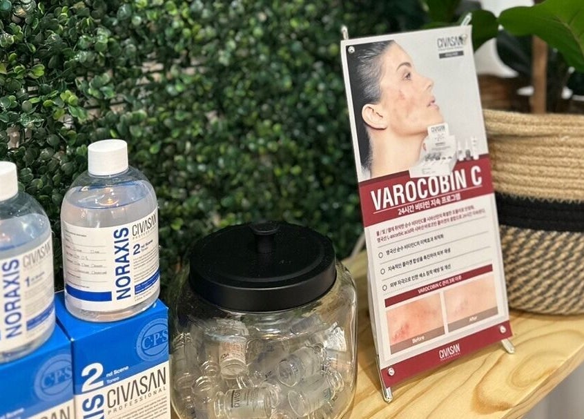 Display of skincare products at Soo Healing Studio, Toronto, Ontario, CA surrounded by lush greenery.