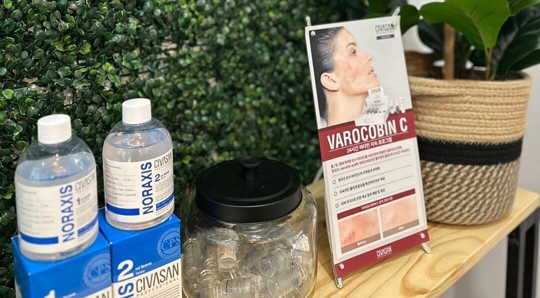 Display of skincare products at Soo Healing Studio, Toronto, Ontario, CA surrounded by lush greenery.