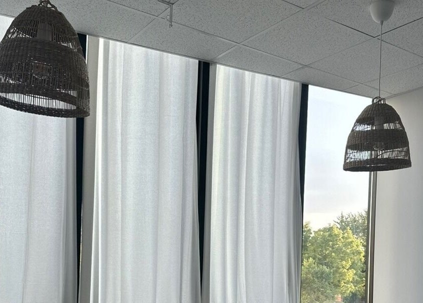 Elegant wicker lampshades hang in Soo Healing Studio, Toronto, Ontario, CA, creating a serene ambiance.