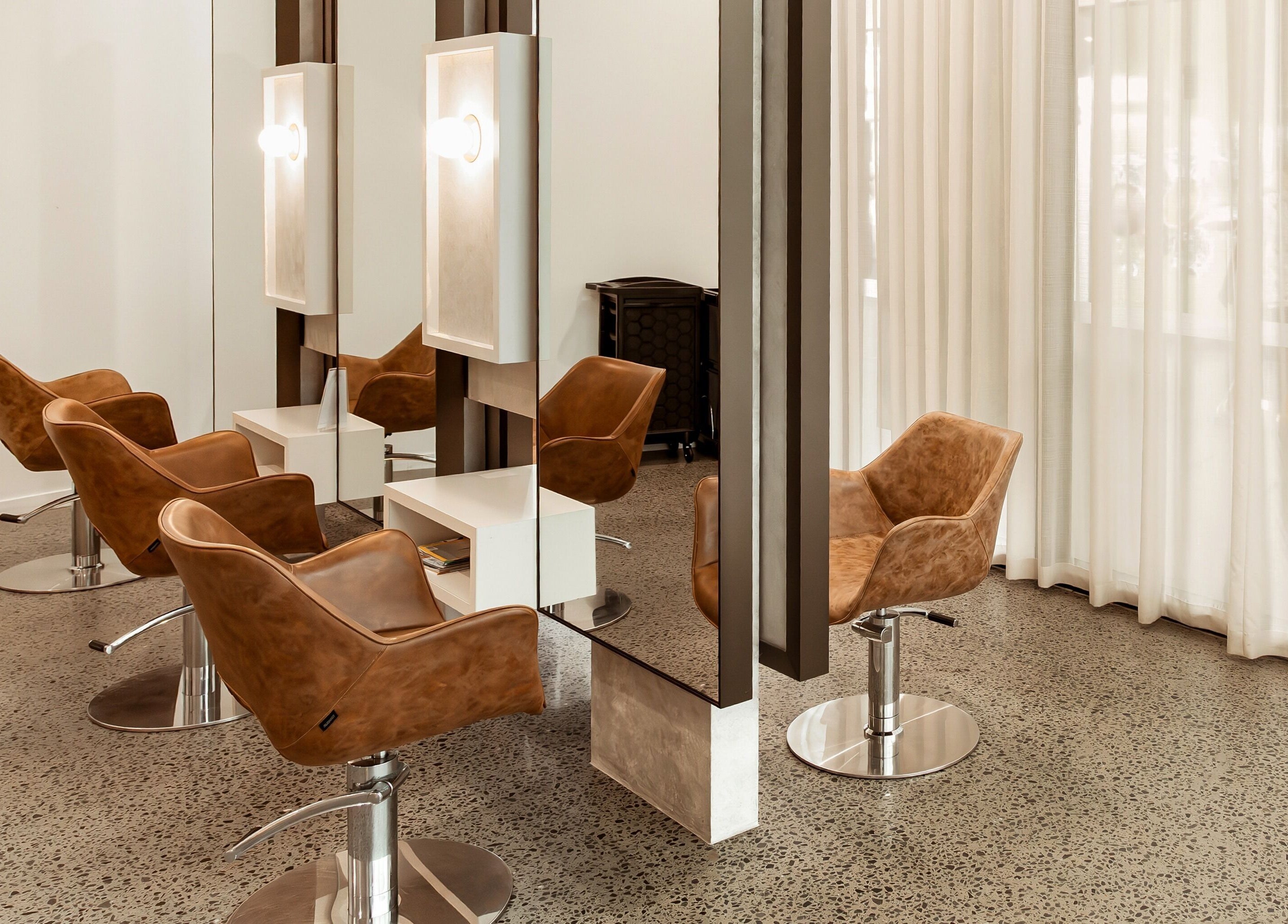 Stylishly modern salon chairs at Lennox Hair in Lennox Head, New South Wales, AU.