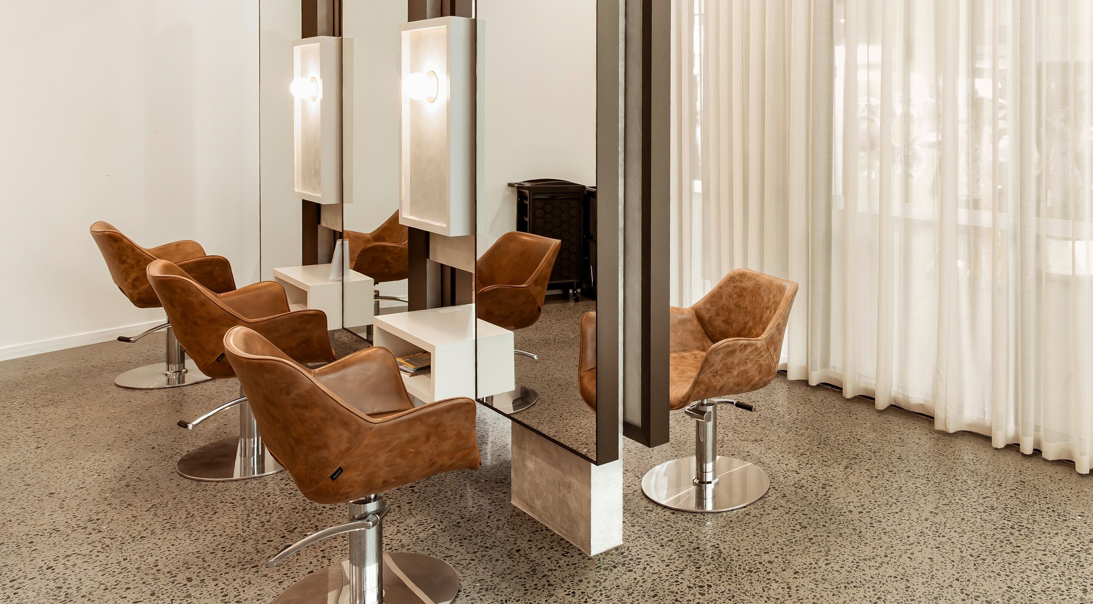 Stylishly modern salon chairs at Lennox Hair in Lennox Head, New South Wales, AU.