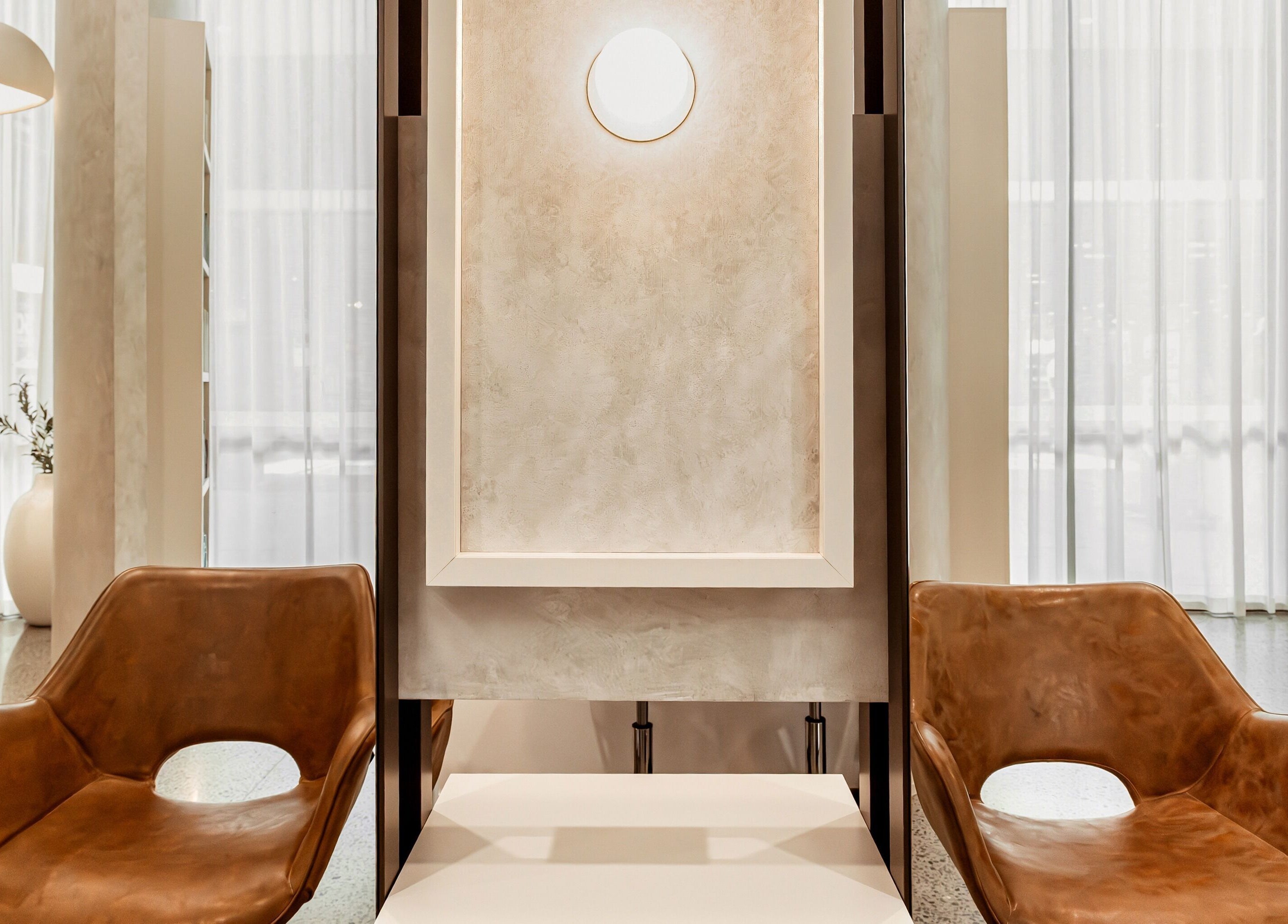 Elegant seating and ambient lighting in Lennox Hair salon at Lennox Head, New South Wales, AU.