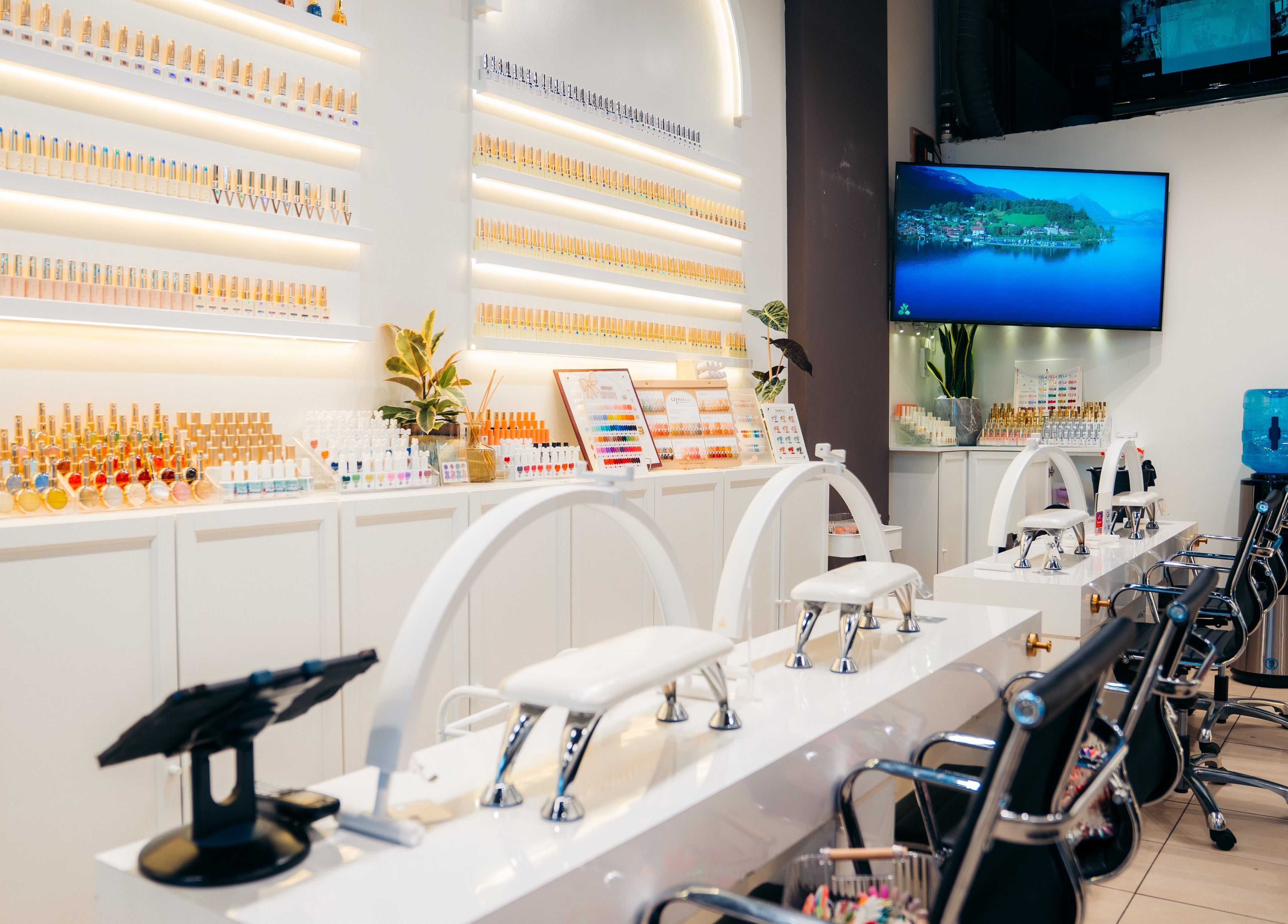 Modern nail bar at Robson Nails & Spa, Vancouver, British Columbia, CA showcasing vibrant polishes and stylish seating.