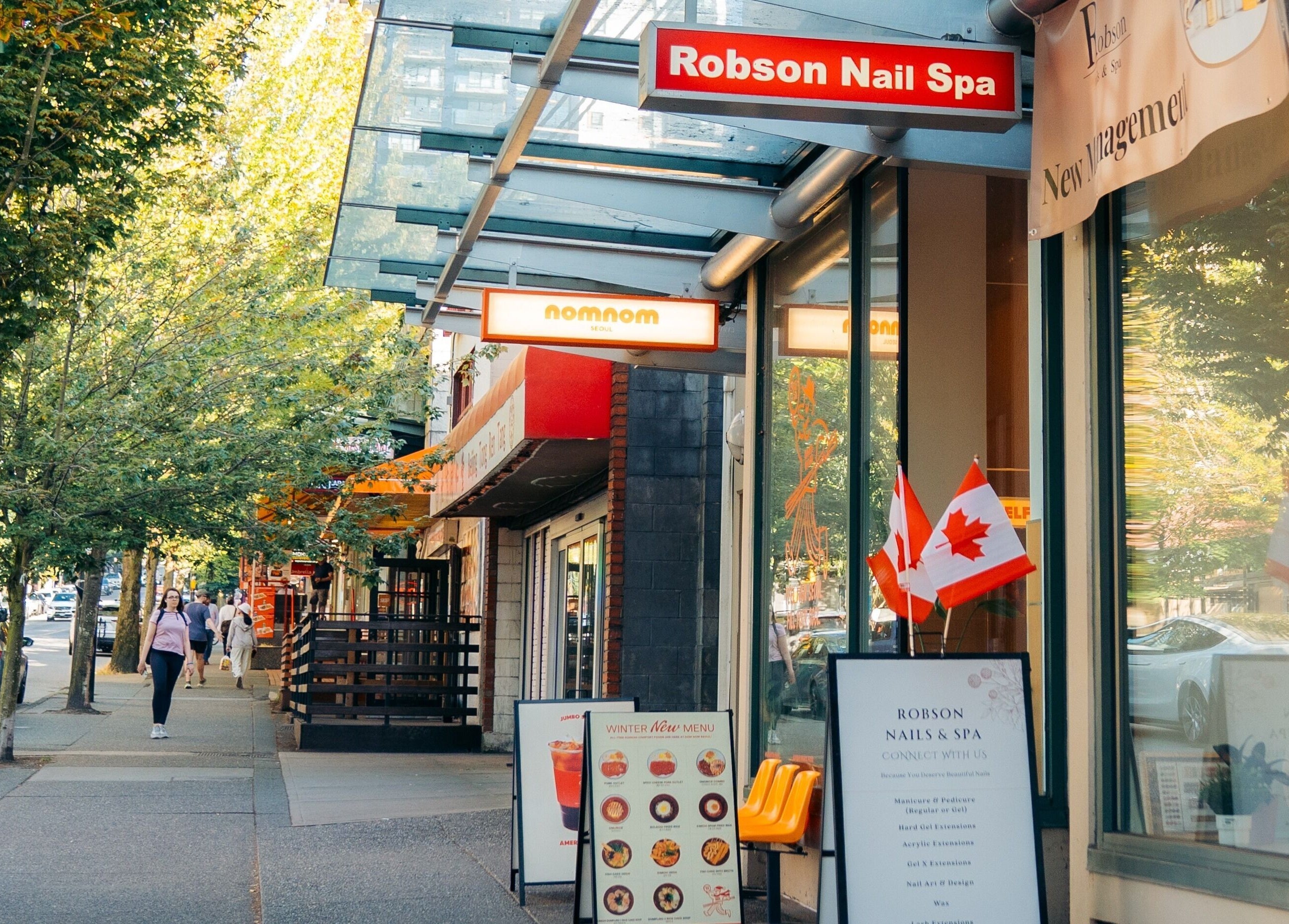 Exterior view of Robson Nails & Spa in Vancouver, British Columbia, CA, with street ambience.
