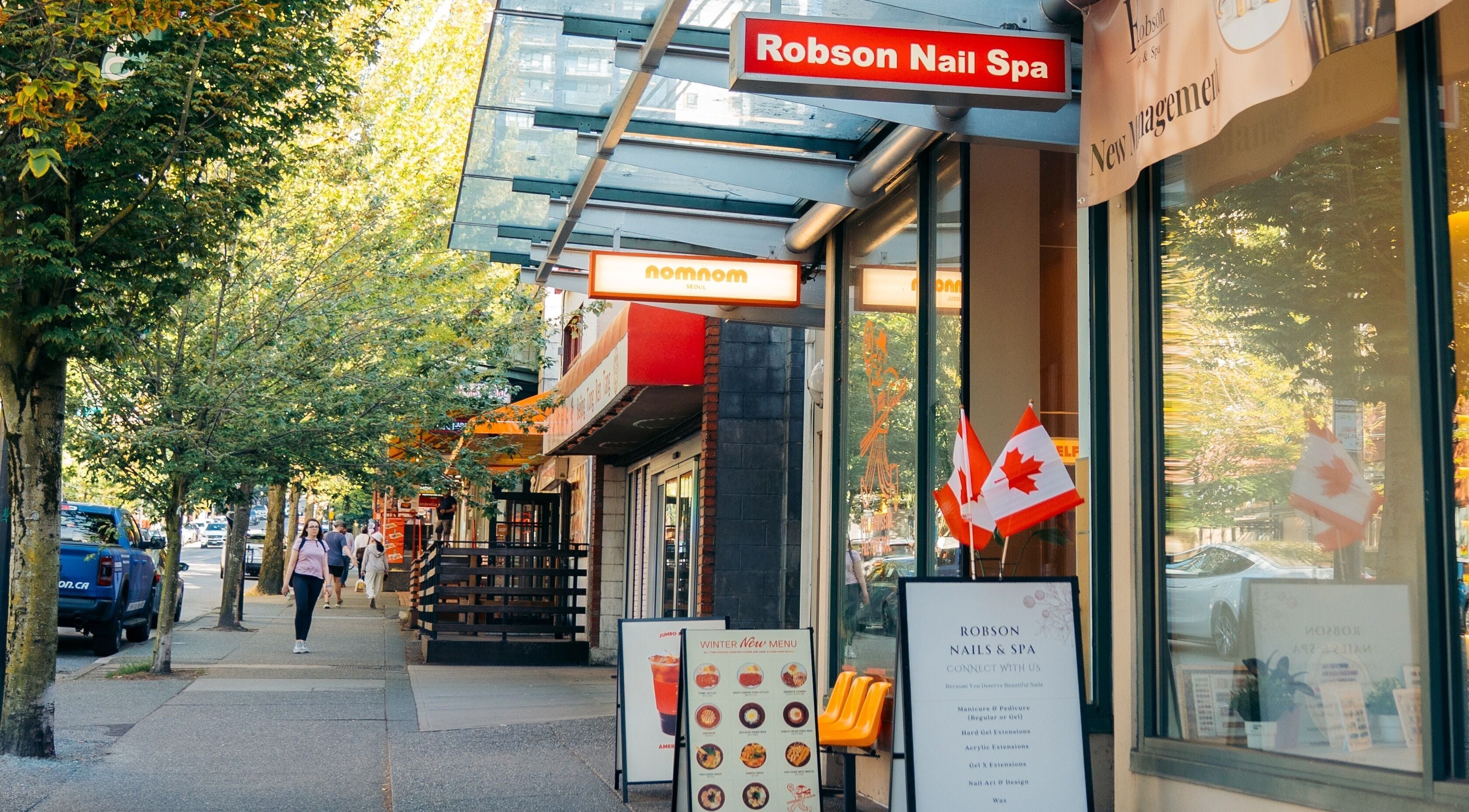 Exterior view of Robson Nails & Spa in Vancouver, British Columbia, CA, with street ambience.
