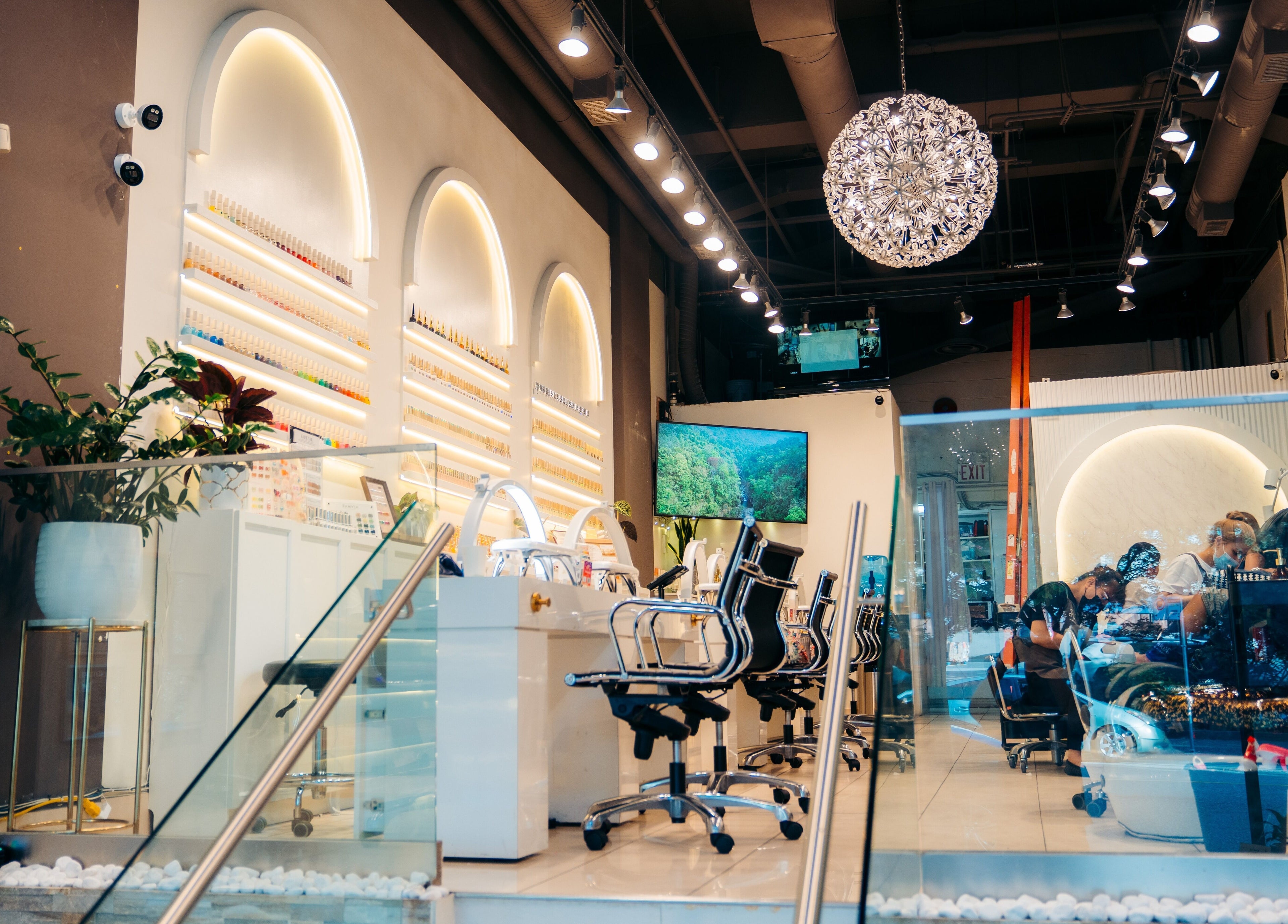Stylish interior of Robson Nails & Spa in Vancouver, British Columbia, CA featuring modern nail stations.