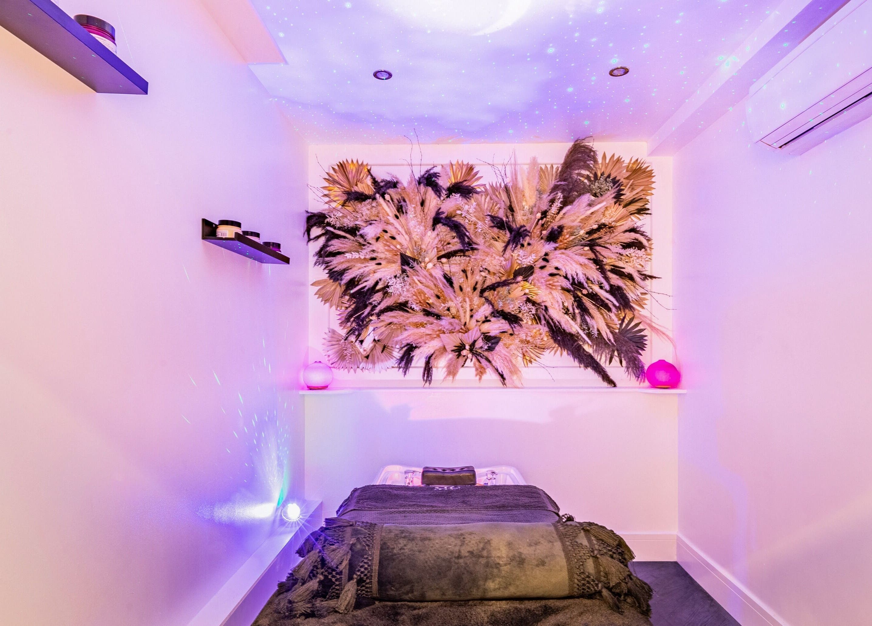 Tranquil treatment room at Maria Charles Aesthetics Crawley, featuring artistic decor in Crawley, England, GB.
