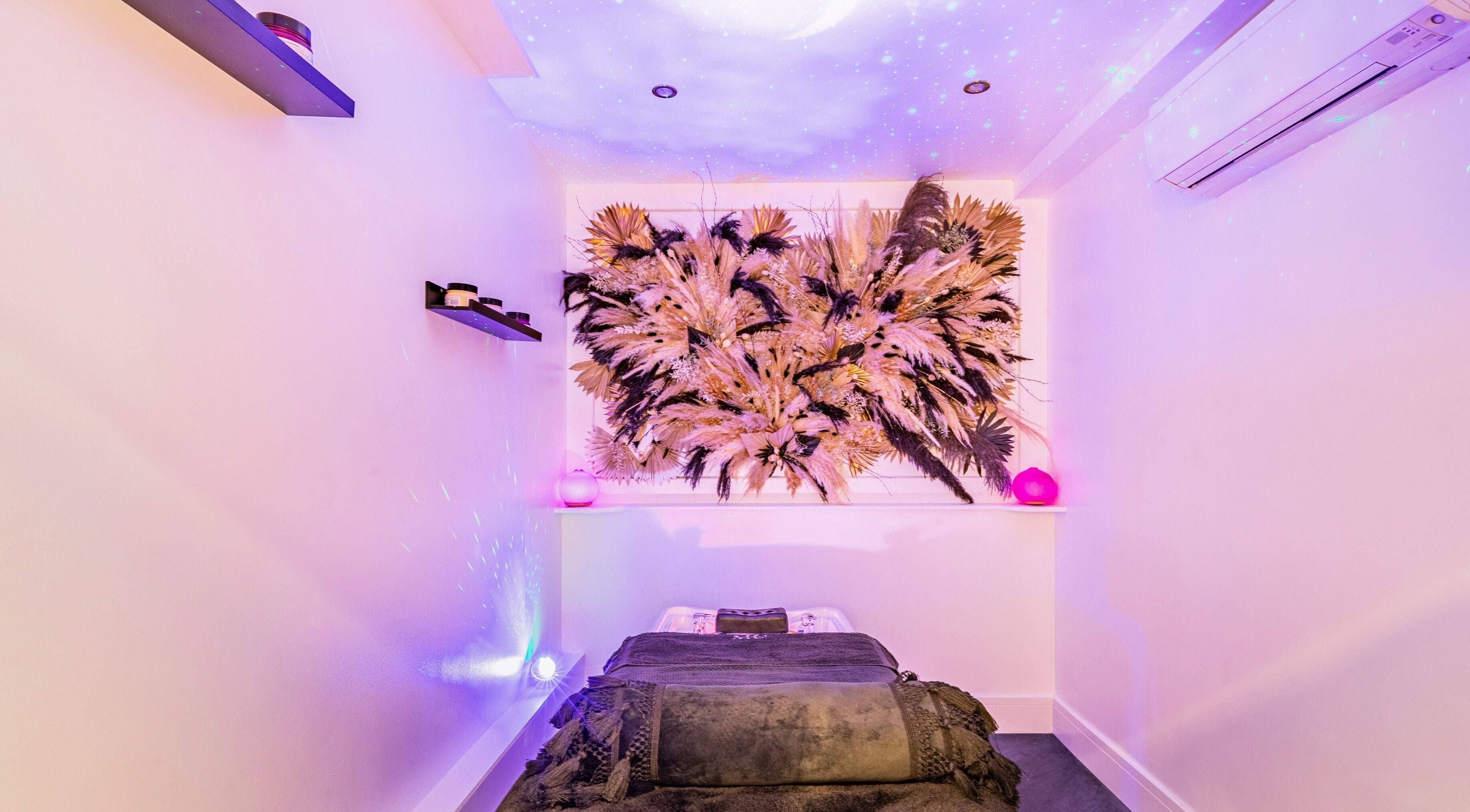 Tranquil treatment room at Maria Charles Aesthetics Crawley, featuring artistic decor in Crawley, England, GB.