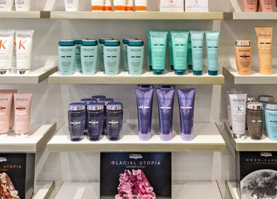 Shelves with luxury hair care products at Maria Charles Hair Crawley, Crawley, England, GB.