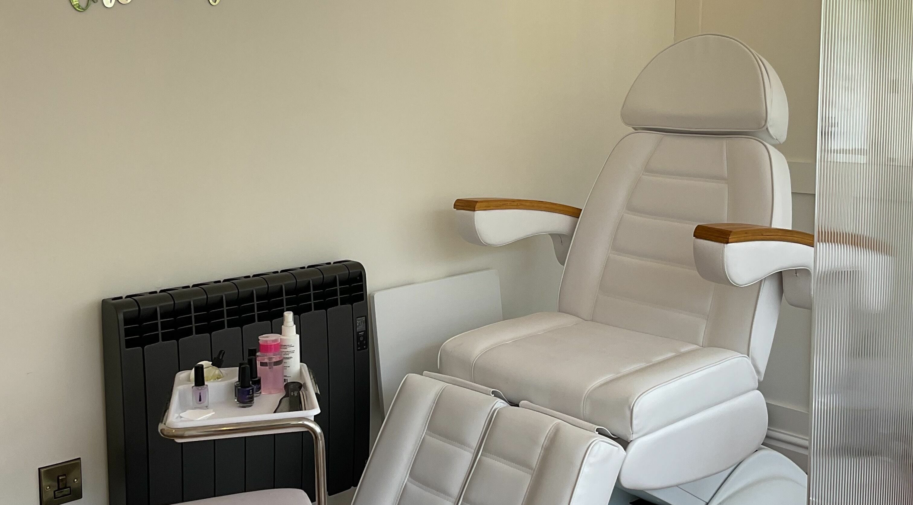 Luxurious white spa chair with manicure tools at Bridge Beauty, Marple Bridge, England, GB for ultimate relaxation.