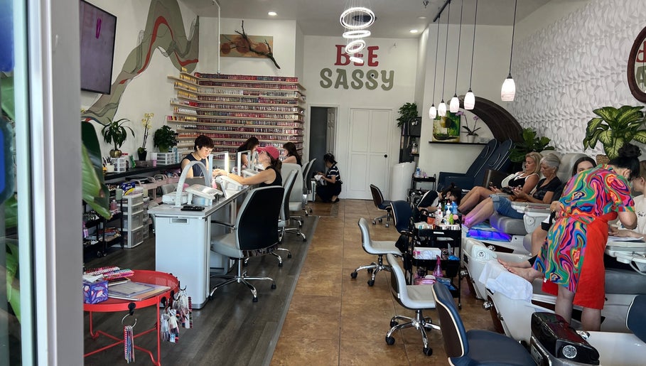 Interior of Bee Sassy Nails in Rocklin, California, US showing a vibrant nail salon with clients and staff.