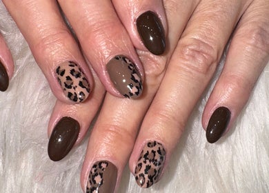 Elegant leopard print nails at Bee Sassy Nails in Rocklin, California. Stylish nail art for a bold look.