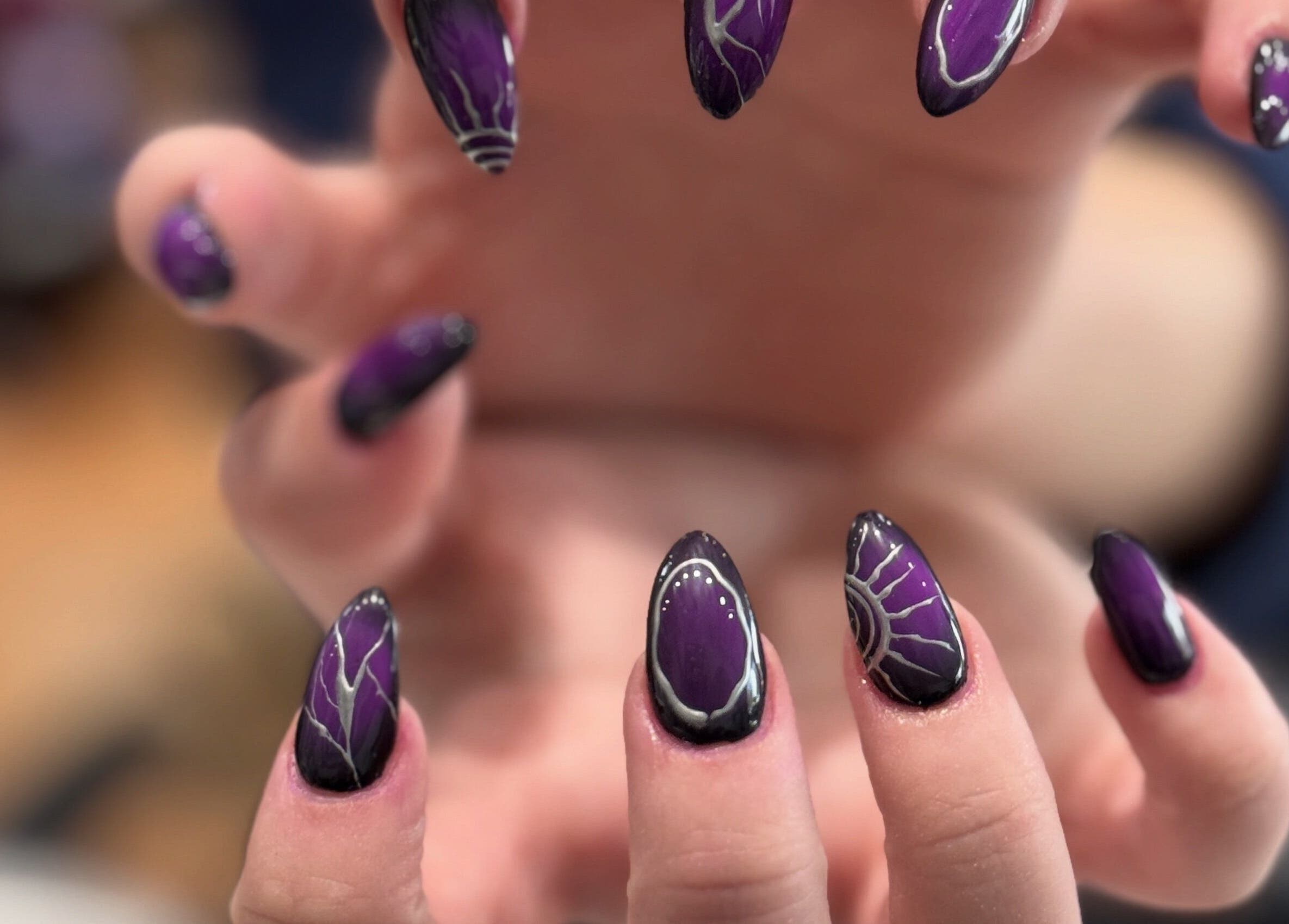 Bold purple nail art from Bee Sassy Nails, Rocklin, California, US, showcasing intricate design.