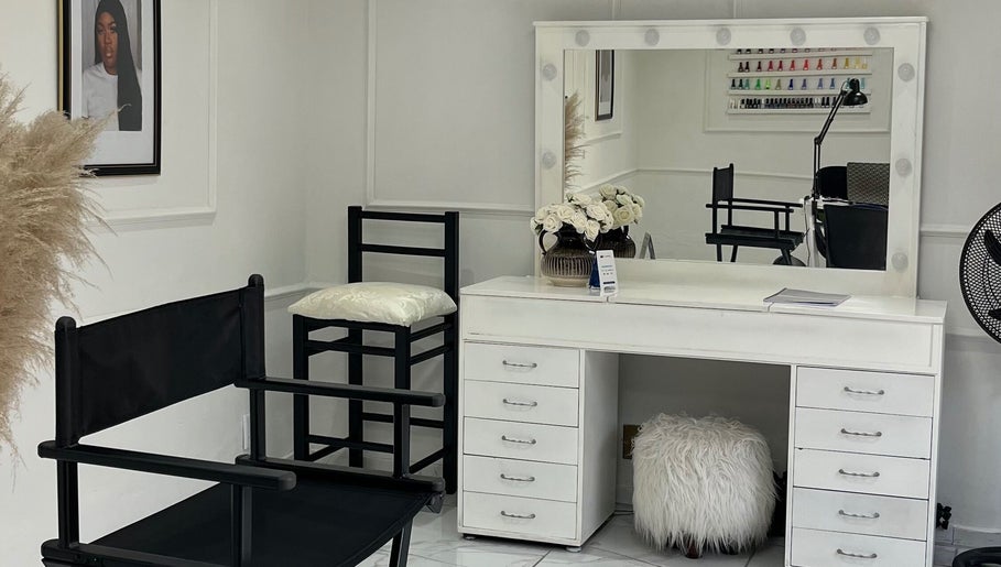 Elegant makeup station at Shira Glam Studio, Roodepoort, Gauteng, ZA featuring a mirror and stylish chair.