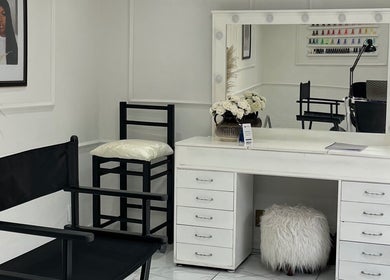 Elegant makeup station at Shira Glam Studio, Roodepoort, Gauteng, ZA featuring a mirror and stylish chair.