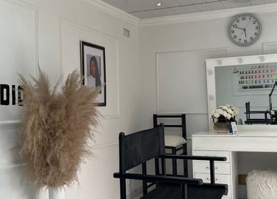 Elegant interior of Shira Glam Studio, Roodepoort, Gauteng, ZA, featuring modern decor and beauty workstations.