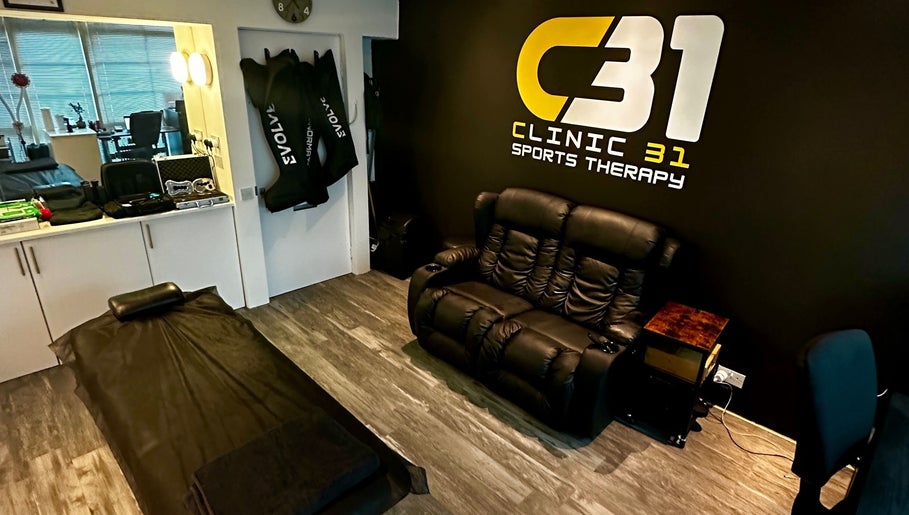 CLINIC 31 - SPORTS MASSAGE THERAPY & HIJAMA CUPPING treatment room in Birmingham, England, GB, featuring comfortable seating.