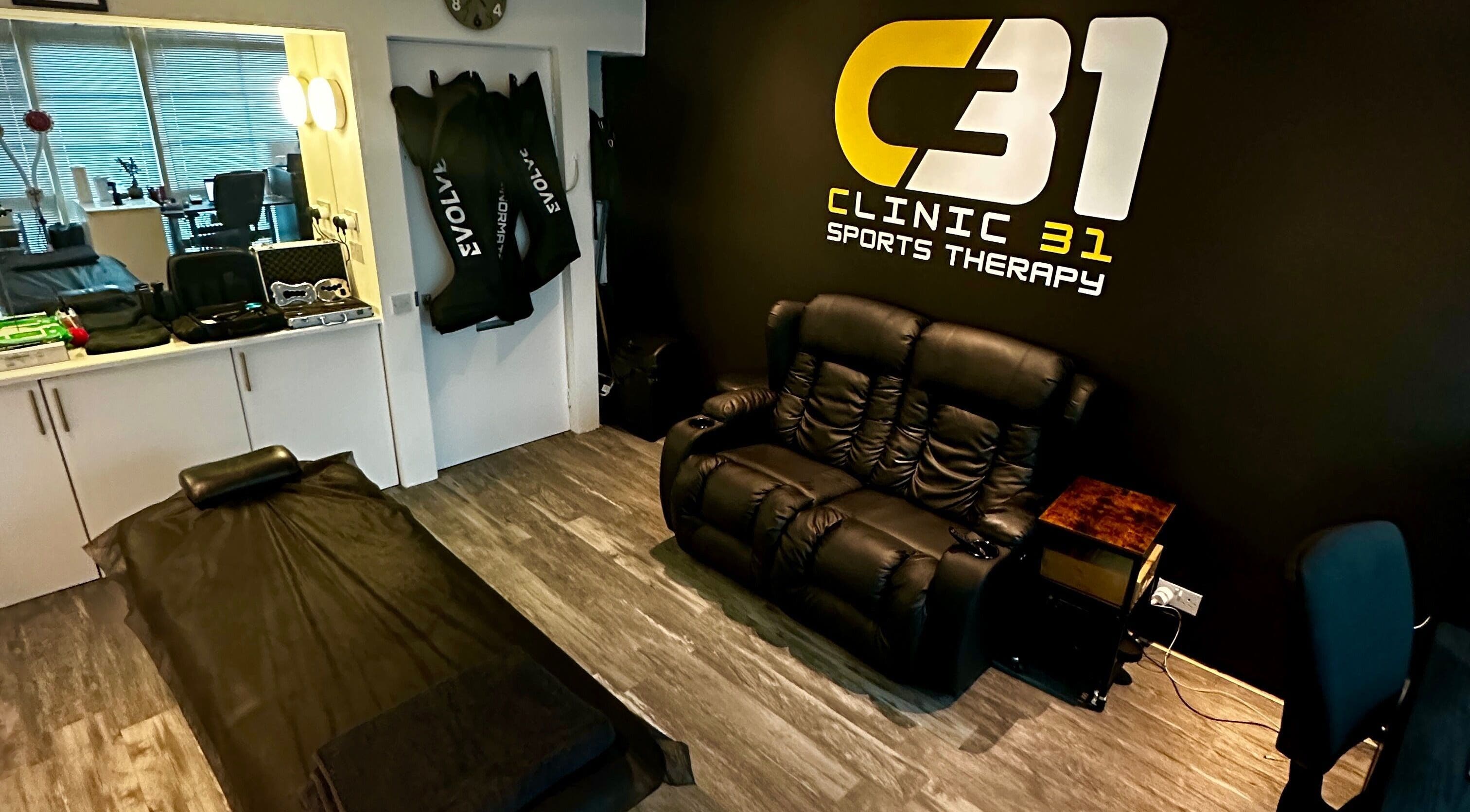 CLINIC 31 - SPORTS MASSAGE THERAPY & HIJAMA CUPPING treatment room in Birmingham, England, GB, featuring comfortable seating.