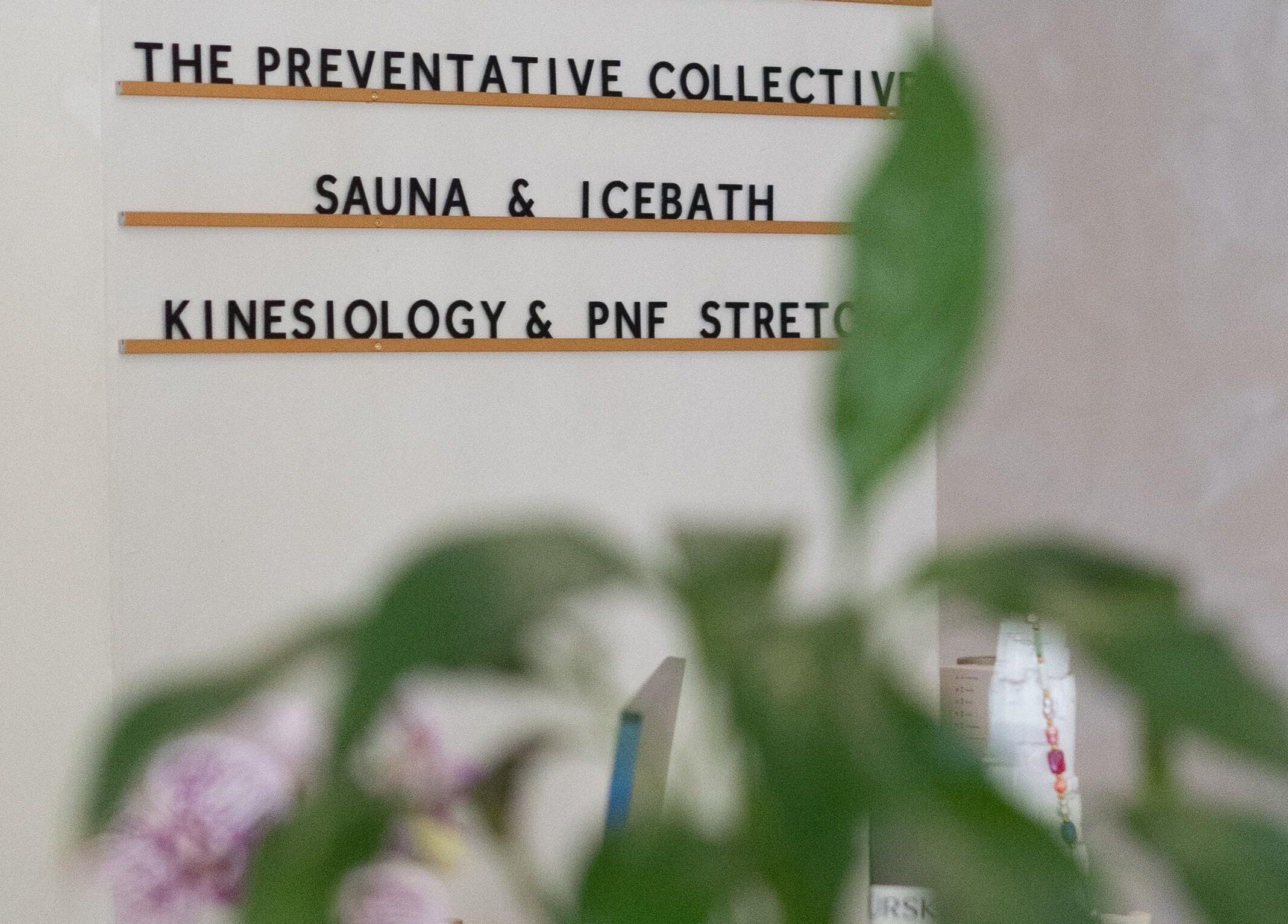 Signage displaying The Preventative Collective in West Leederville, Western Australia, featuring wellness services.