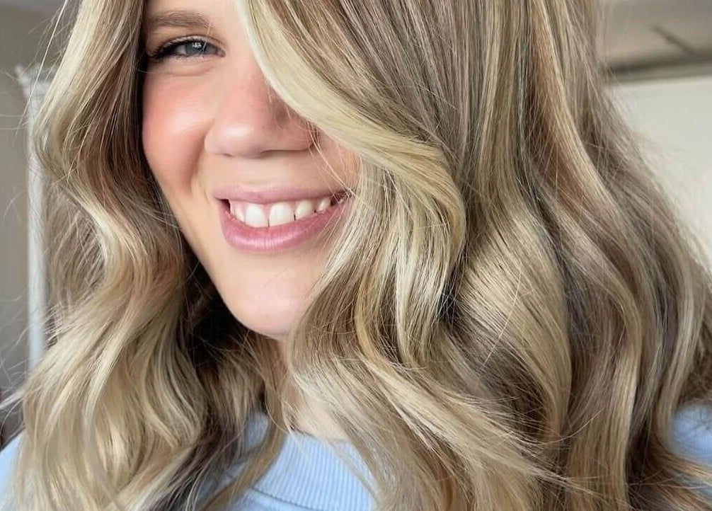 Blonde waves styled at Hair by Cher in Mooloolaba, Queensland, AU showcase expert craftsmanship.