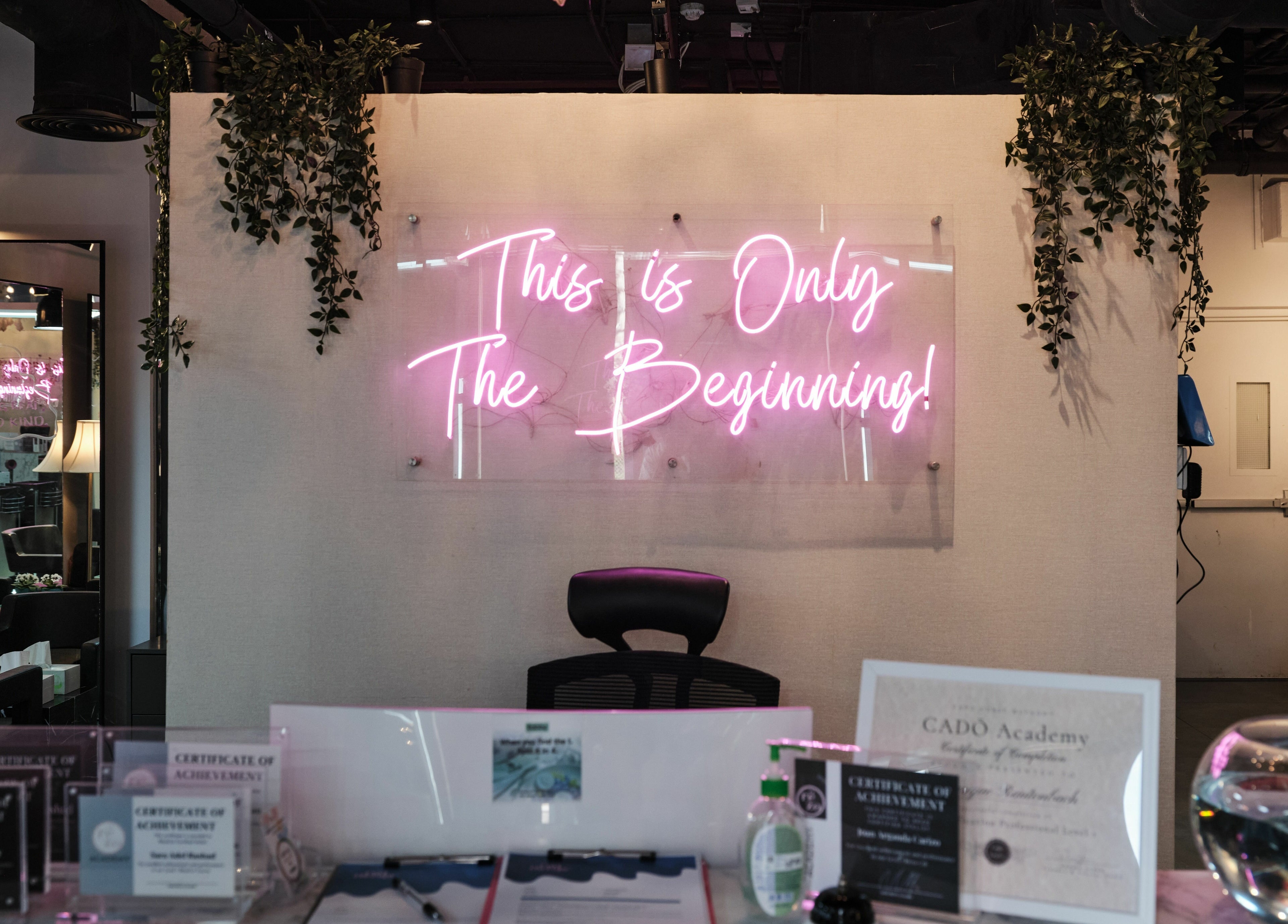 Neon sign 'This is Only The Beginning' at The Curl Therapy, Dubai, Dubai, AE.