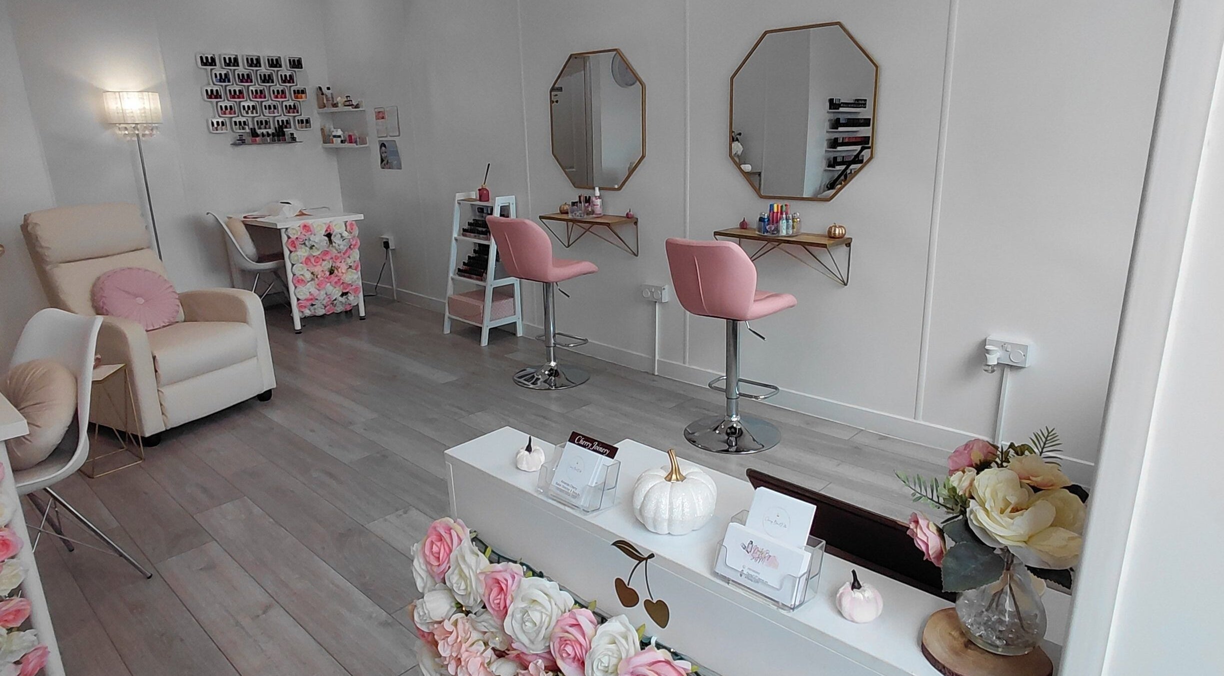 Cherry BeautElla salon in Perth, Scotland, GB, featuring plush pink chairs and stylish decor.